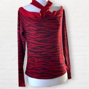 RED Haute animal print cold shoulder sweater. Long sleeves w/crisscross neckline